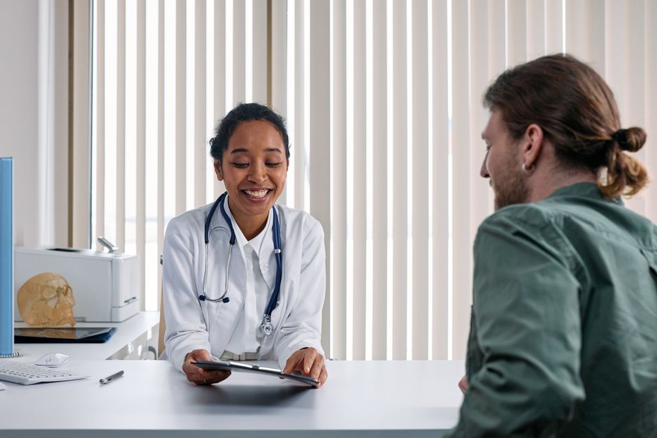 Doctor consulting with a family in a bright clinic room
